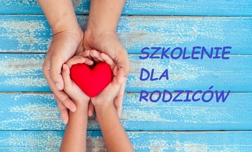 Grafika przedstawia czerwone serce w małych rączkach, trzymanych w dużych rękach.